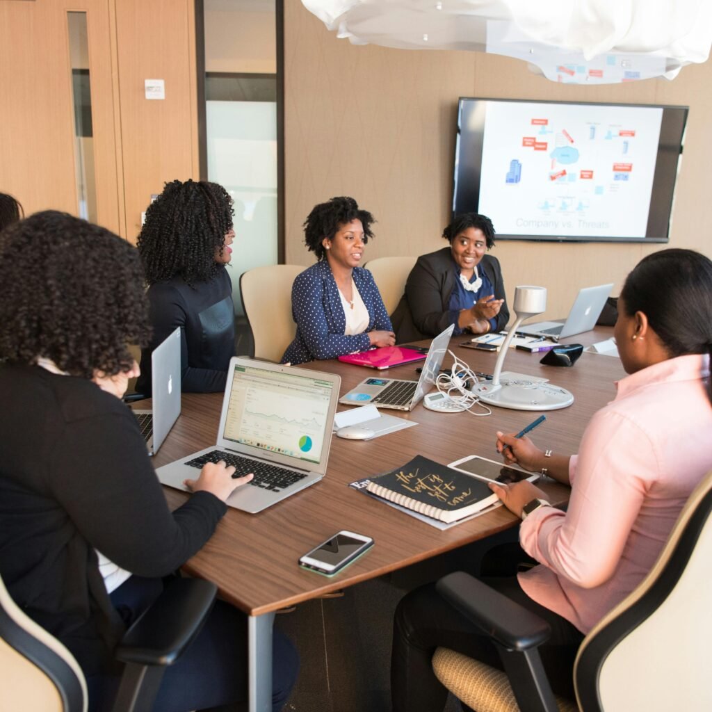 Diverse team engaging in a productive business meeting in a modern office setting.